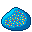 A painted rock of various paint splatters. The rock itself is blue