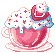 A tea cup with a strawberry milkshake topped with a strawberry and a huge dollop of whipped cream