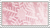 A pink stamp with several snowflakes